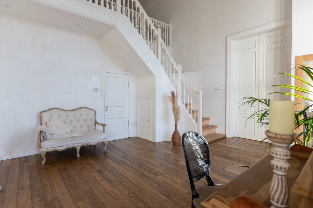 Hardwood flooring installed in an entryway with rustic elements
