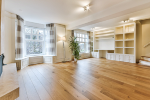 Image showing the newly installed flooring of a room, demonstrating the importance of high-quality flooring for investment properties.