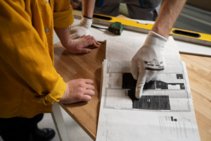 Professionals planning the renovation of a commercial space, reinforcing the importance of choosing between commercial remodeling vs new construction