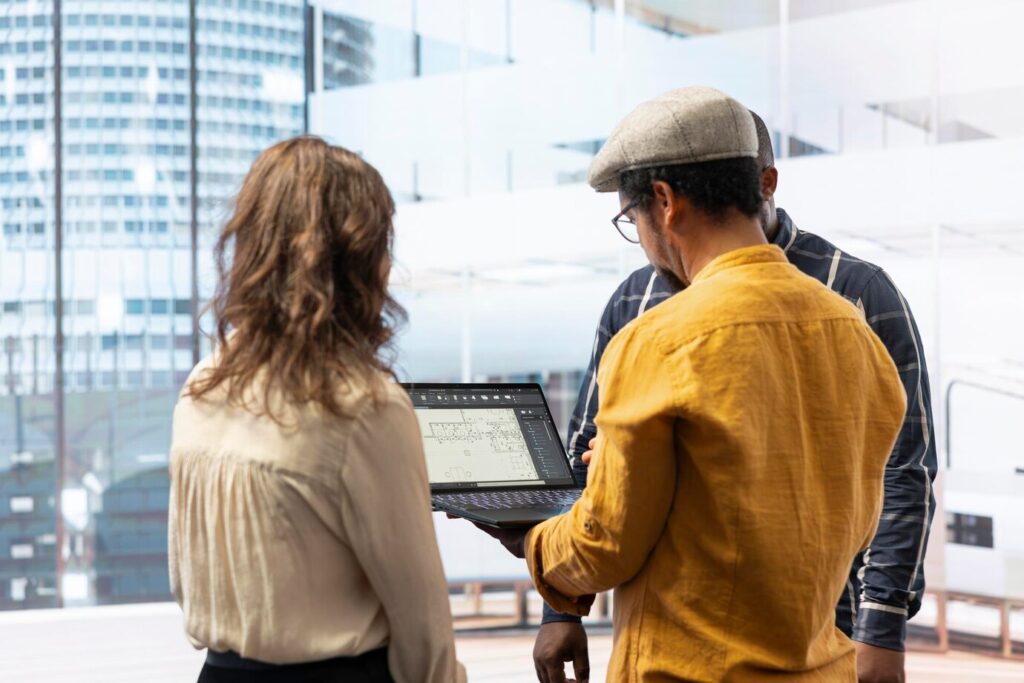 Business owners evaluating a custom commercial construction plan.