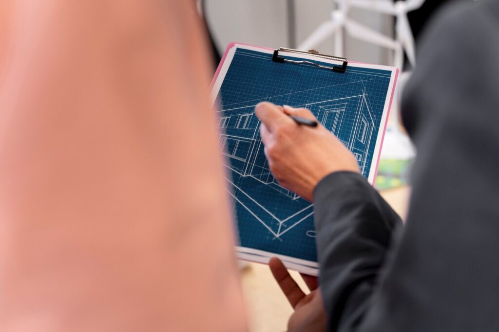 Man showing an energy-efficient plan for a custom commercial construction project.