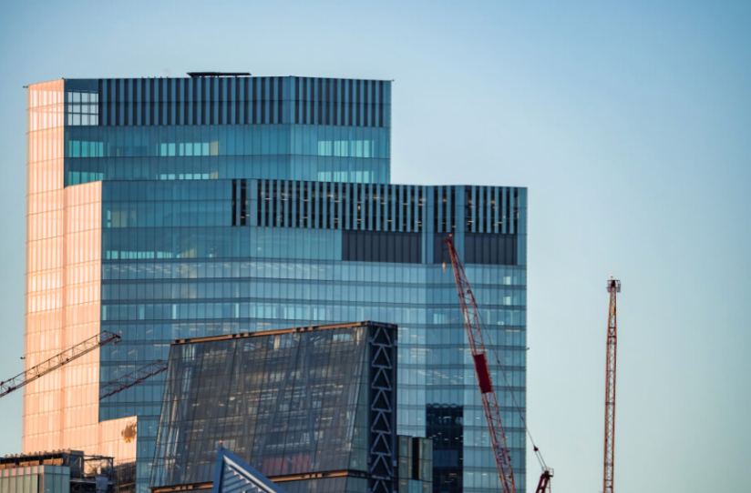 Panoramic view of a commercial building under construction, representing the importance of investing in specialized commercial contractors.