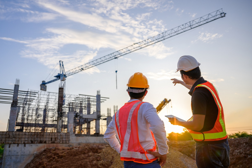 Two men talking about challenges in commercial construction